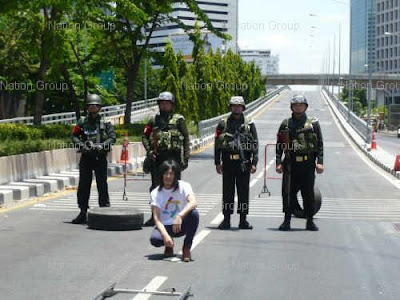 The Richman Toy's singer makes a video in front of soldiers on Rama IV Road.