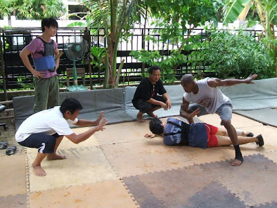 Panna Rittikrai framing the shot during preliminary choreography with Crump.