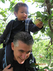 Alexandre picking his first apple