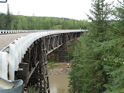 Original curved wooden bridge on old Alcan