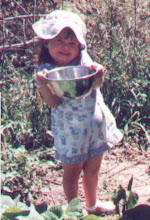 My lil bean girl, Pickin greenbeans out of Aunti Kimmer's garden when she was two.