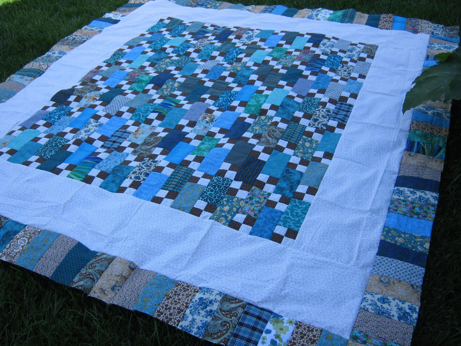 Love Laugh Quilt turquoise and brown