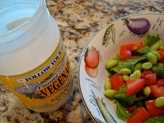 Bowl of Edamame Salad next to jar of vegenaise