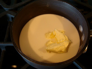 Margarine and coconut milk in saucepan on stove