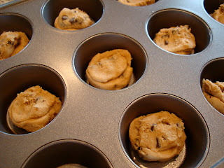 Cookie dough pieces in muffin tin