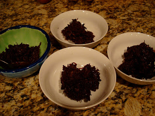 Four bowls of Raw Vegan Chocolate Coconut Snowballs
