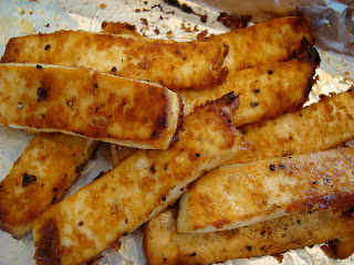 Stacked Sesame Ginger Maple Baked Tofu in foil lined pan