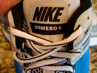 Close up of Nike Vomero 5 on the tongue of shoes