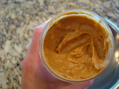 Inside open jar of peanut butter