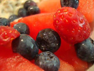 Watermelon, strawberries and blueberries stacked together