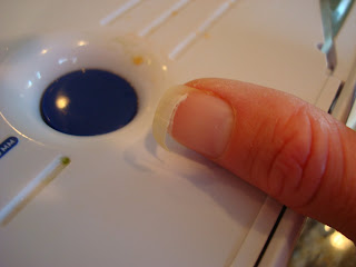 Sliced fingernail from mandolin blade