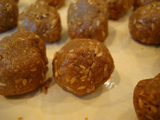 Raw Vegan Donut Holes on white plate showing flaxseed
