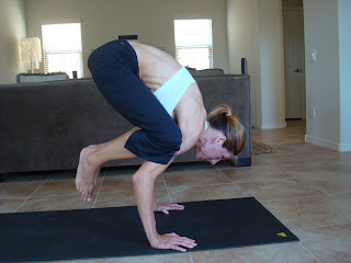 Woman doing Crane yoga pose