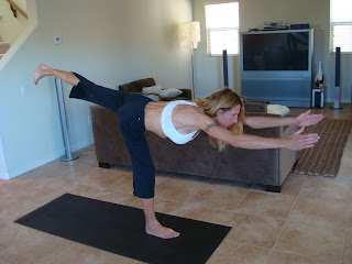 Woman doing Warrior III yoga pose