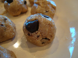 High Raw Vegan Chocolate Chip Cookie Dough Balls on plate showing chocolate chips