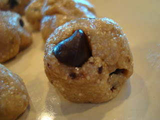 Close up of Raw Vegan Chocolate Chip Cookie Dough Ball on plate
