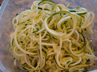 Spiralized zucchinis in clear container