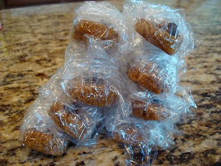 Pairs of cookies wrapped in plastic wrap and stacked on one another