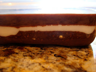 Side view of bars showing crust, center and chocolate topping