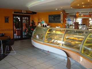 Inside cafe in Aruba showing food behind glass