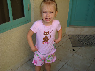 Crying young girl in pink