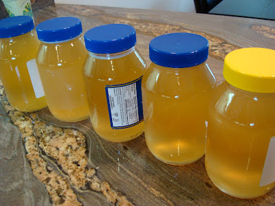 Jars of mango juice-infused homemade kombucha