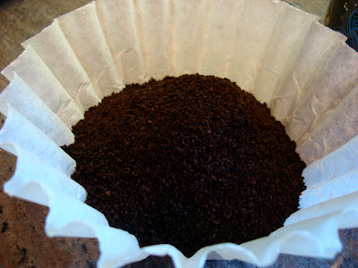 Close up of coffee grounds in filter 