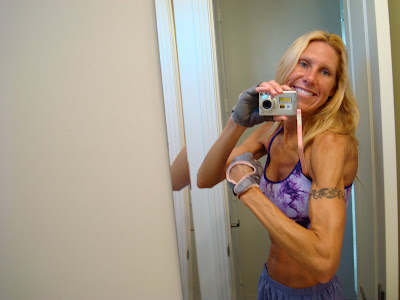 Woman flexing other arm showing tattoo