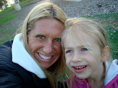 Woman and young girl outside smiling