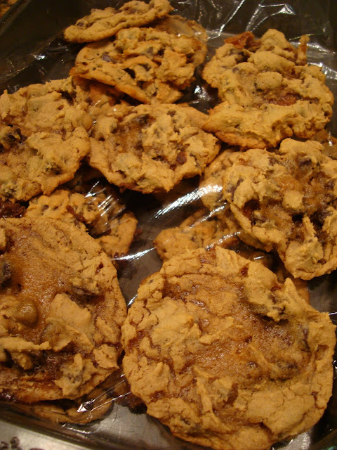Vegan GF Peanut Butter Caramel Chocolate Chip Cookies in container with plastic wrap