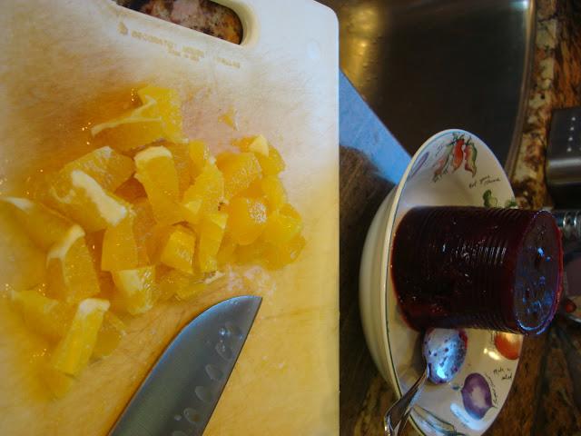 Diced up orange and cranberry sauce out of can