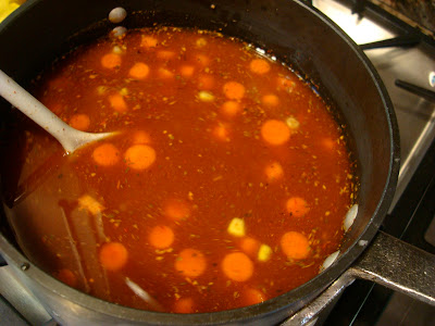 Spoon stirring Spicy Vegetable, Corn, & Bean Soup