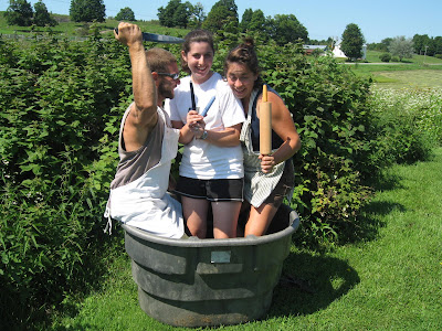 three men in a tub