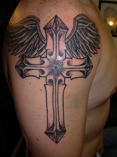tattoos on arm tribal. tribal arm tattoos. cross