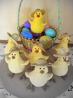 a basket of chick sculptures