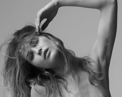 anything Erin Wasson, which even extends to her tattoos. The feather on
