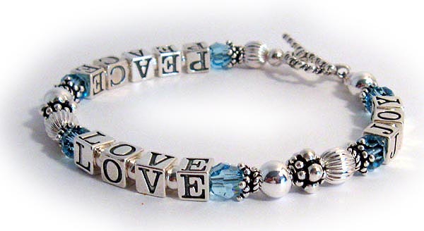 This PEACE LOVE JOY bracelet is made with Swarovski crystals (you choose the This PEACE LOVE JOY bracelet is made with Swarovski crystals (you choose the