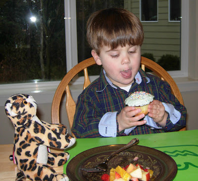 boy eating cupcake