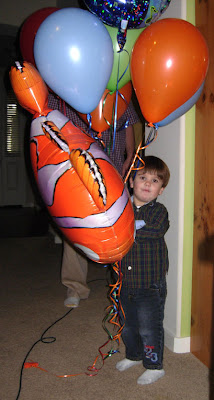 boy and birtday balloons