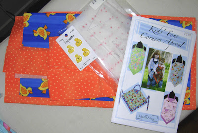 apron fabrics all cut out and ready to go