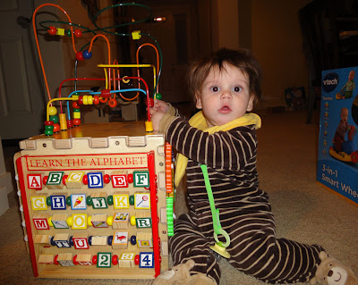 baby boy playing with his new activity cube
