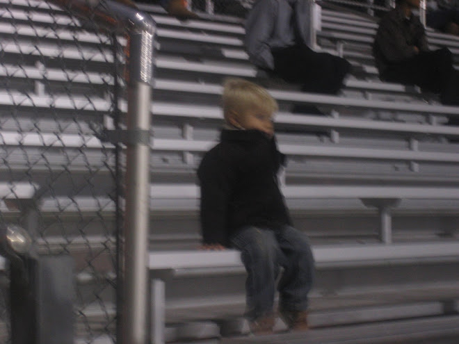 Kolton cheering on some kids in our ward at their soccer game