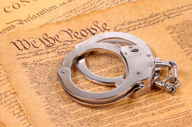 [handcuffs-and-constitution.jpg]