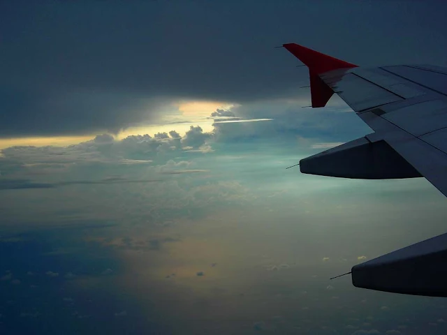 AirAsia wing and clouds over Sumatra