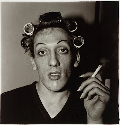 A Young Man in Curlers at