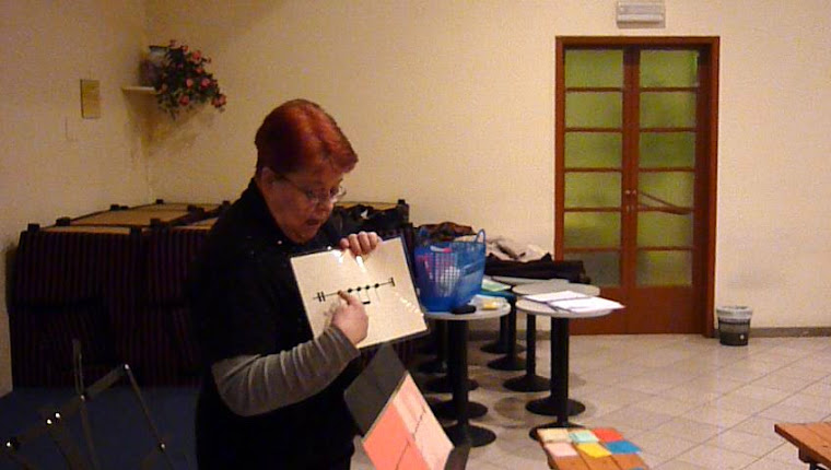 Joan illustrates a page to children