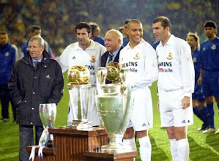 Ronaldo Nazario looks at his 2002 FIFA World Cup winners trophy