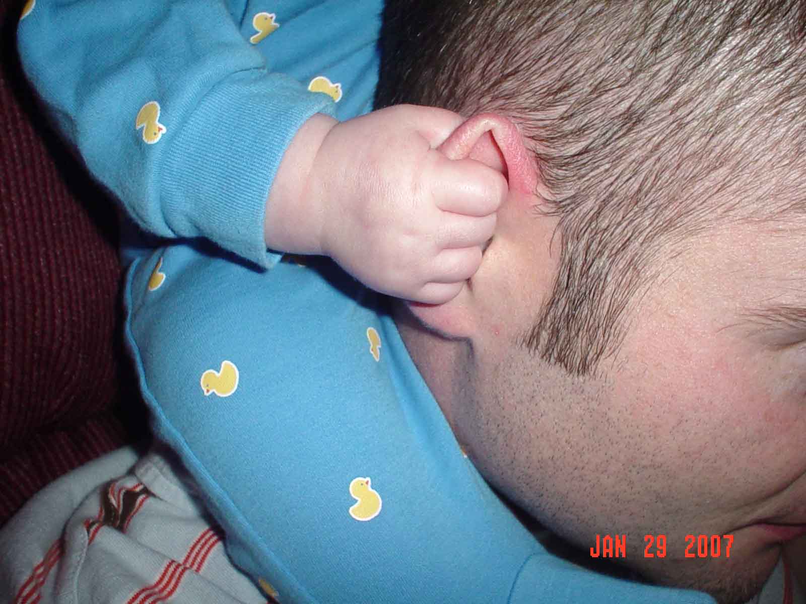 [Gavin+holding+Daddy's+ear.jpg]