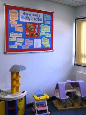 Noticeboard and toys in the waiting room