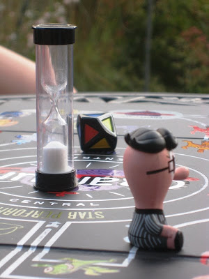 Hourglass and figure on a board game